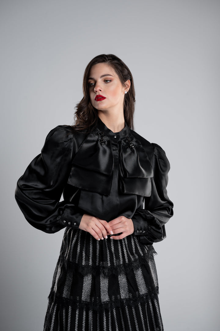 A SATIN BLOUSE WITH 3 LAYERS OF BOW ON EACH SIDE AND COLLAR CRYSTALS